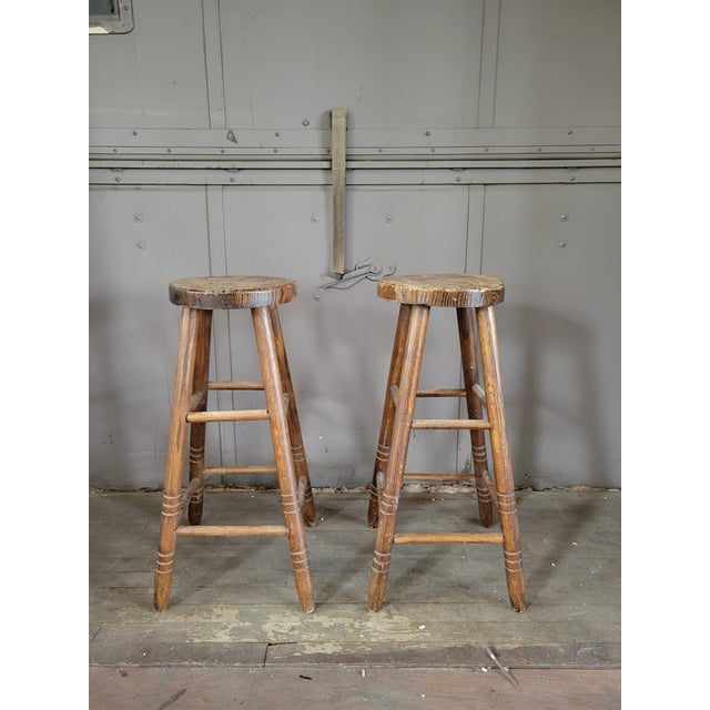 Pair of late 19th-early 20th century antique wooden pub stools. No hardware, handmade and hand joined. Sturdy, lovely...