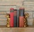 Beautiful column-form bookends feature stylized Ionic capitals and boldly carved acanthus detail. Gilded plaster is...