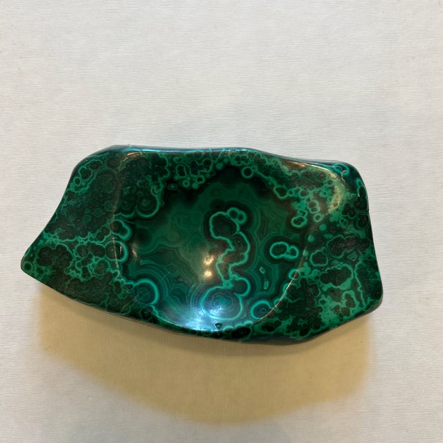 Chunk of natural malachite that can be used as a catchall, or ashtray, or vanity dish. No noticed major chips/cracks. Some...