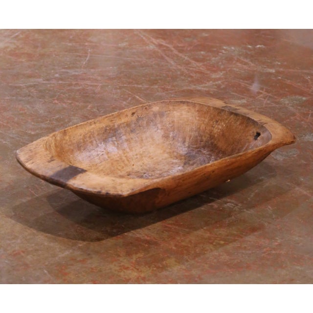 This authentic antique French dough bowl was hand-carved from a single solid block of elm in France circa 1880 and...