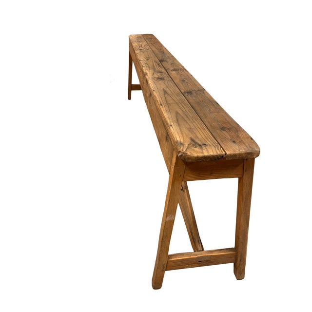 Farmhouse "A" frame style pine bench. Two boards make up the seat and a bottom stretcher provides stability. The bench is...