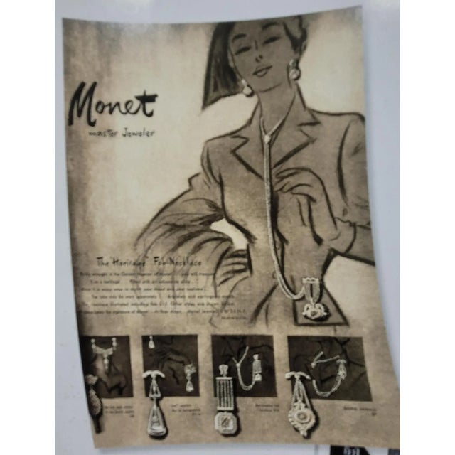 This is part of Chairish’s Costume Jewelry assortment. Pale goldtone pendant brooch with security clasp. Marked "Monet."...