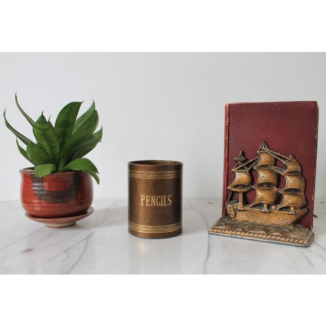 Vintage brown and gold desk top pencil holder. No makers mark. Some light age wear.