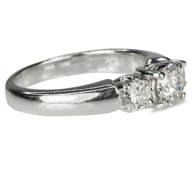 14k ring with 3 round brilliant diamonds weighing 1.05 carats, 5.35g size 7
