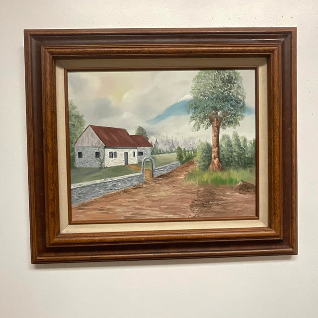 Offering a pretty landscape architectural oil painting estimated from the 1970s based on the frame materials and style....