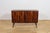 This elegant sideboard was manufactured by the Danish furniture maker Oman Jun during the 1960s. The piece is...