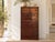 Sweeping red-orange grain fills the sliding doors of this tansu, each panel framed in black with a round recessed pull....