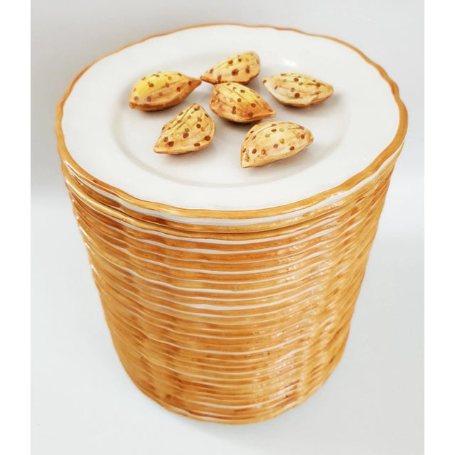 Offering an outstanding vintage hand painted Trompe l'Oeil Majolica Porcelain lidded jar depicting a stack of 29 plates...