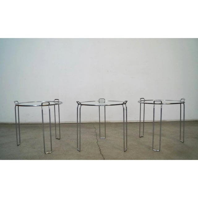 Vintage original Midcentury Modern nesting tables for sale. Set of 3 drinking tables in chrome, and manufactured in the...
