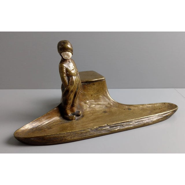 Signed at bottom of back side 8 3/4" wide x 5" deep - 4 1/4" to top of figure's head Biography The sculptor Peter...