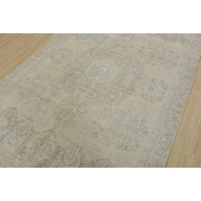 An authentic vintage traditional Tabriz rug hand-knotted with an all-wool pile on a cotton foundation. This oriental rug...