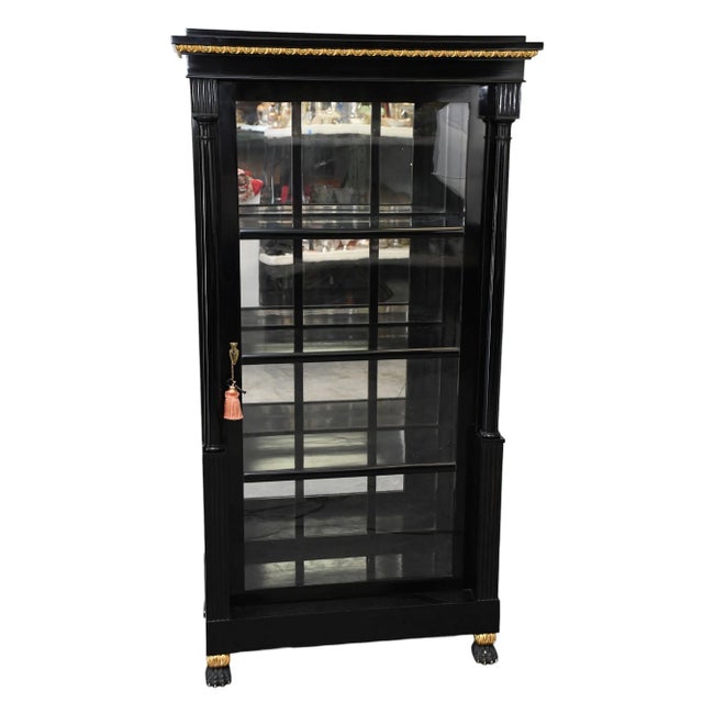 This Antique Biedermeier 19th C Black lacquer Display Cabinet is a beautifully crafted piece from Austria, dating back to...