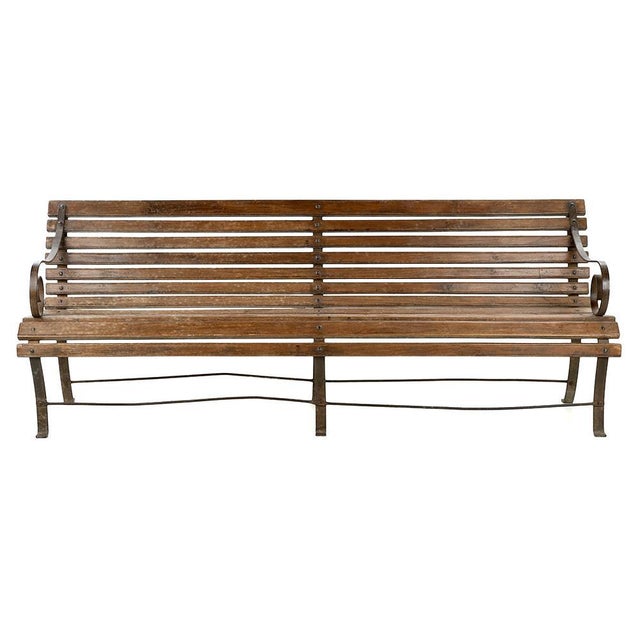 This solid wood and iron bench perfectly illustrates the authenticity of furniture found at flea markets. with its...