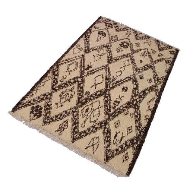 Hand knotted from finest quality wool, this one-of-a-kind fashionable handmade Moroccan rug crafted by skilled artisans...