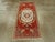 A vintage Turkish Oushak throw rug. The ribbon cloud band corners position ivory and grass green central oval medallion on...