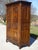 An imposing oak wardrobe, beautifully crafted in France, mid-20th century. Numerous carved motifs with pronounced relief...