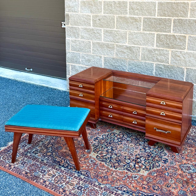 A Mid Century Modern Kling Furniture solid cherry 6 drawer vanity and bench from their Cherry Modern collection. The...