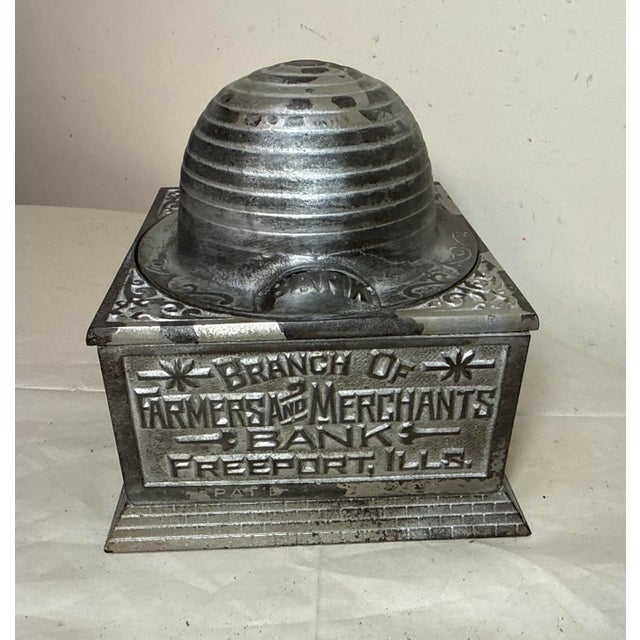 The Large Antique 1892 Economy Accumulates Wealth Cast-Iron Beehive Mechanical Bank is a unique and collectible piece from...