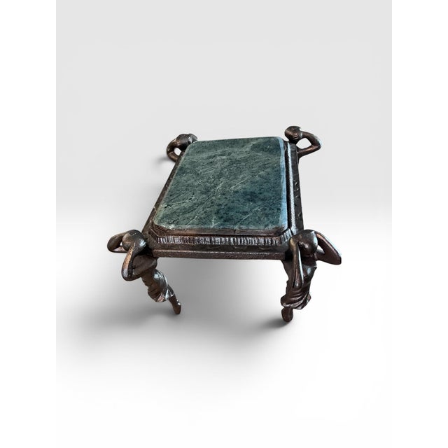 Elevate your décor with this striking vintage figural pedestal stand featuring four sculptural female caryatid figures...
