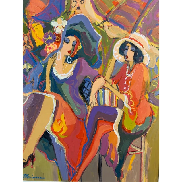 A beautiful bold Isaac Maimon original acrylic on canvas of two fashionable ladies with cross legs seated at a cafe with...