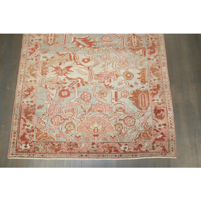 An accent size Persian Malayer rug in greens and pink from the 1st quarter of the 20th century