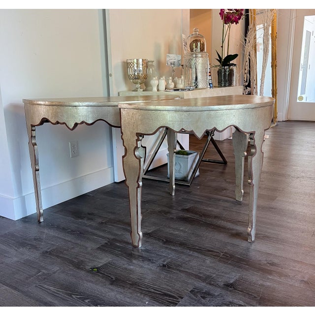 These stunning console tables are adorned with silver leaf and a delicately painted edge. They are in brand new condition...