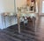 These stunning console tables are adorned with silver leaf and a delicately painted edge. They are in brand new condition...