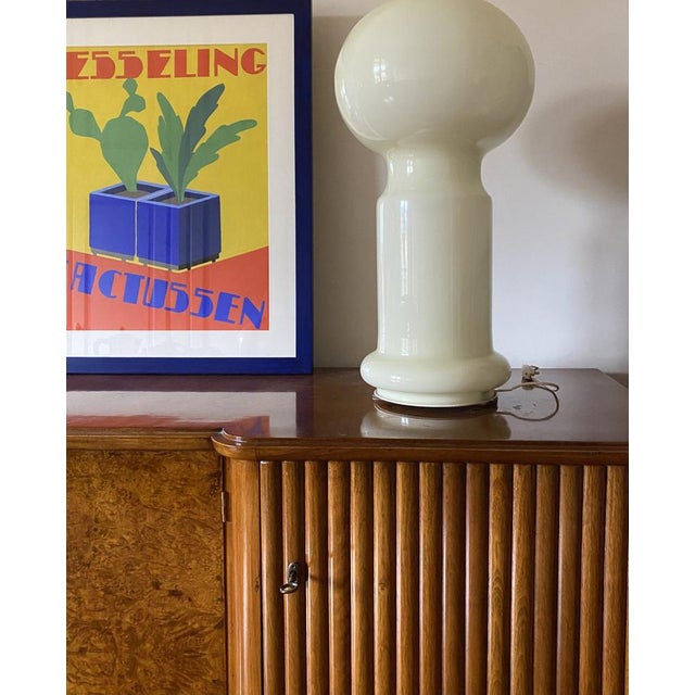 Space age murano glass table lamp. vistosi, italy 1960s pale yellow / beige glass. three bulbs inside; a large one with...