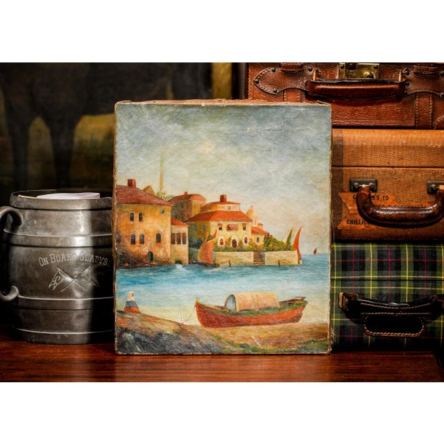 This charming antique oil painting on canvas, dating back to circa 1900, captures a serene coastal village scene that...