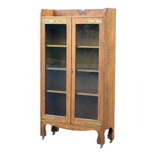 Antique Carved Oak Glass Door Locking Bookcase With Decorative Brasses For Sale