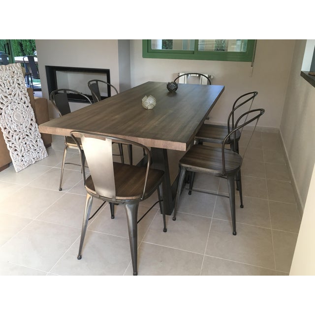 About 21st century wrought iron set of patio dining set Six chairs with wood seat and table with spectacular wood top You...