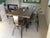About 21st century wrought iron set of patio dining set Six chairs with wood seat and table with spectacular wood top You...
