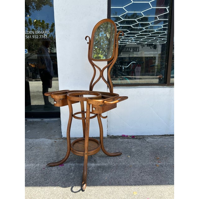 Rare and remarkable 19th century Bent wood shaving stand crafted in mahogany with a swivel mirror, two drawers and all the...