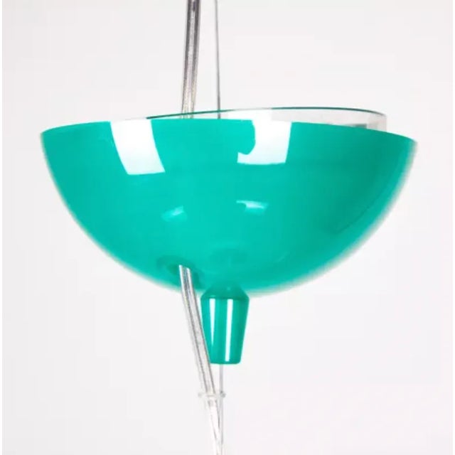 This iconic Fl/y plastic pendant, designed by Ferruccio Laviani for Kartell in the 2000s. It is made from plastic material...