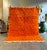 Brighten your space with this luxurious handmade Mrirt rug in a deep burnt orange hue, crafted with love and precision in...