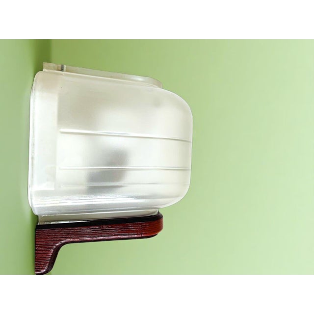 This elegant wall sconce was made by Allibert in the Netherlands in the 1990s. It is made of semi-opaline thick glass and...