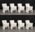 Set of Eight Skyline Design "Jamaica" Dining Chairs, woven white plastic framed with beige cushions. 34" H x 24" W x 23.5"...