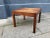 - A low square rosewood side table with a raised edge - It was manufactured in Denmark - In the style of Hans Wegner and...