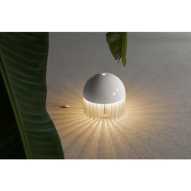 This rare mt table lamp, designed by giancarlo mattioli and manufactured by sirrah, italy, in 1969, is a striking example...