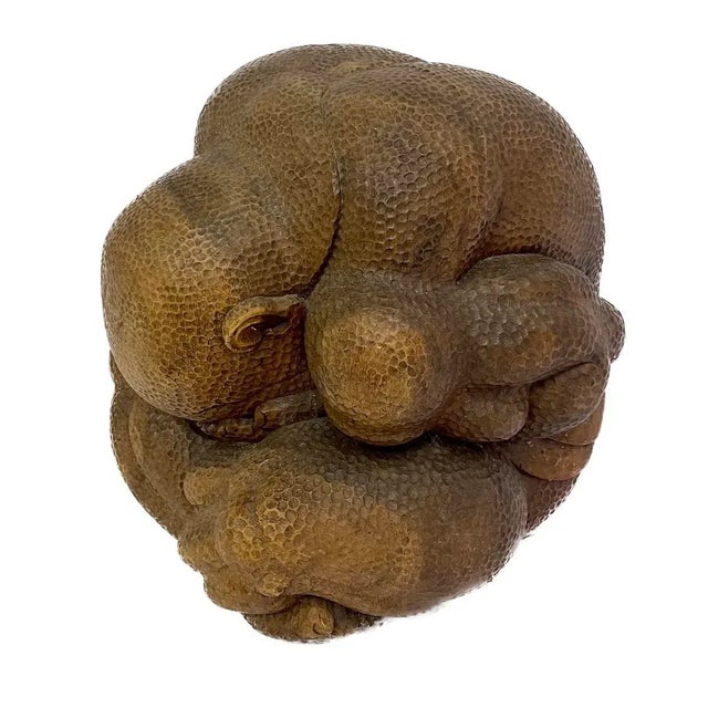 Vintage carved wood sitting Buddha sculpture weeping for the woes of the world. No maker's marks.