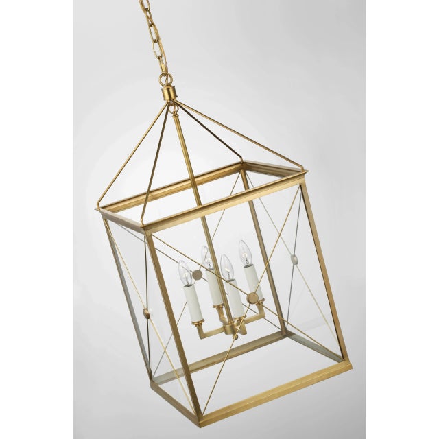 Rossi Medium Lantern in Antique-Burnished Brass with Clear Glass Designer: Julie Neill Canopy: 5.5" Round Mounting: Chain...