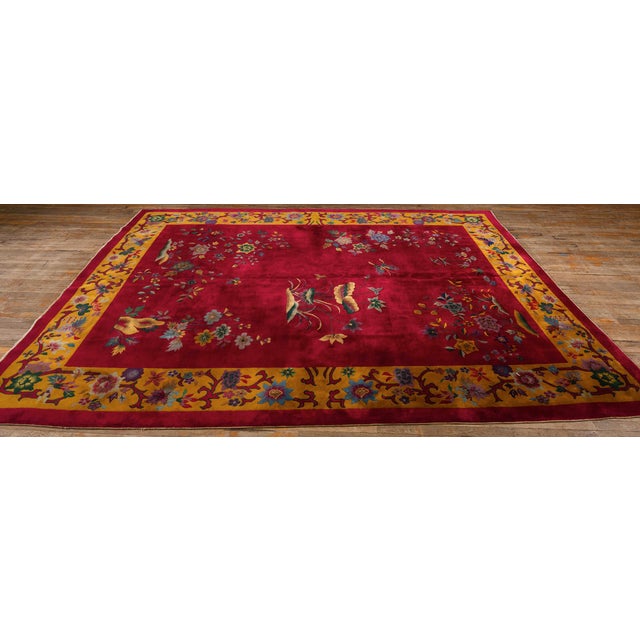 This 1920s Chinese Art Deco rug Antique Rug Studio is characterized by a vibrant fuchsia, monochrome field and asymmetric,...