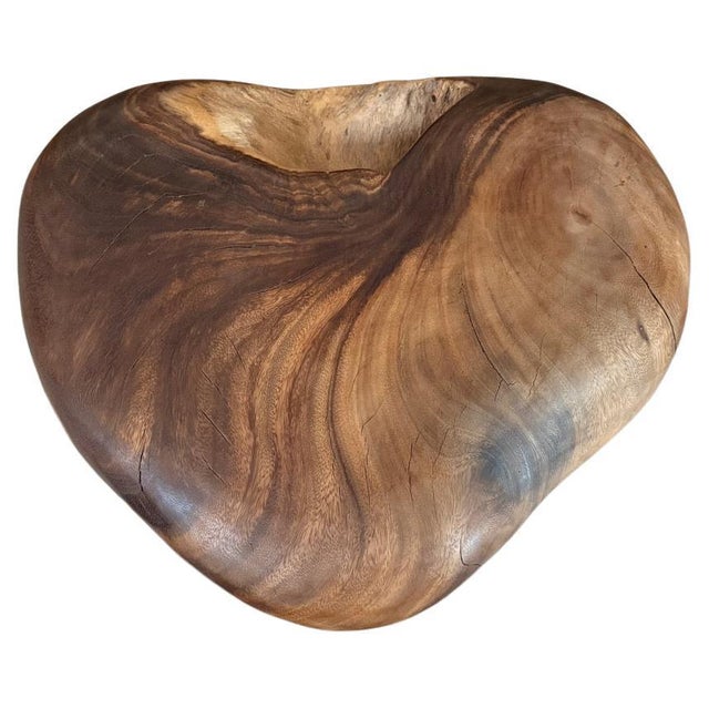 A thick piece of organic wood hand carved into a heart shape. Both sides are unique. Polished with a natural oil revealing...