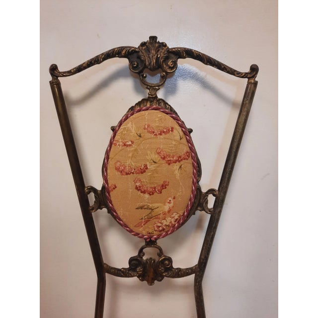 Vintage Italian solid Brass accent chair recently reupholstered in a soft Vintage inspired print and accented with long...