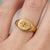 Capture the warmth of the sun and the guidance of the stars. This exquisite Celestial Starburst Signet Ring is a modern...