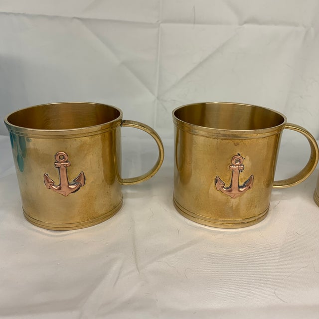 Offered here is a set of vintage brass nautical anchor cups, perfect as captain's mugs or rum mug collections, featuring a...