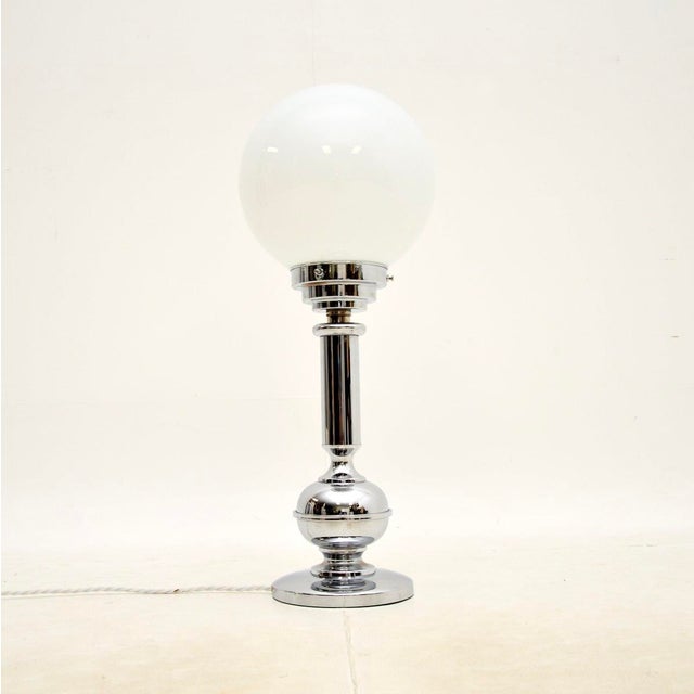 A stylish and very well made Art Deco chrome and glass table lamp, made in England and dating from around the 1930’s. This...