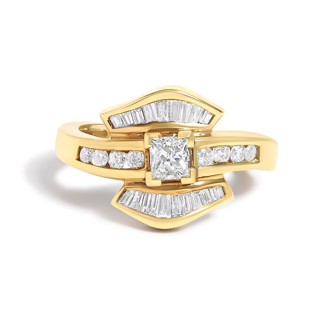 Adorn your finger with the opulence of this exquisite 14kt yellow gold cocktail ring, where a full carat of natural...