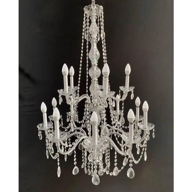 An exquisite vintage Hollywood Regency style French crystal chandelier. Crafted with meticulous attention to detail, this...