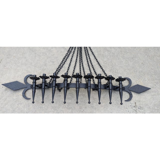 Large Spanish Revival style hand forged wrought iron 9 light wall sconce / Gothic candelabra / candle holder. It is...